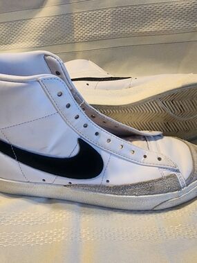 Nike White High-Top Sneakers with Black Swoosh